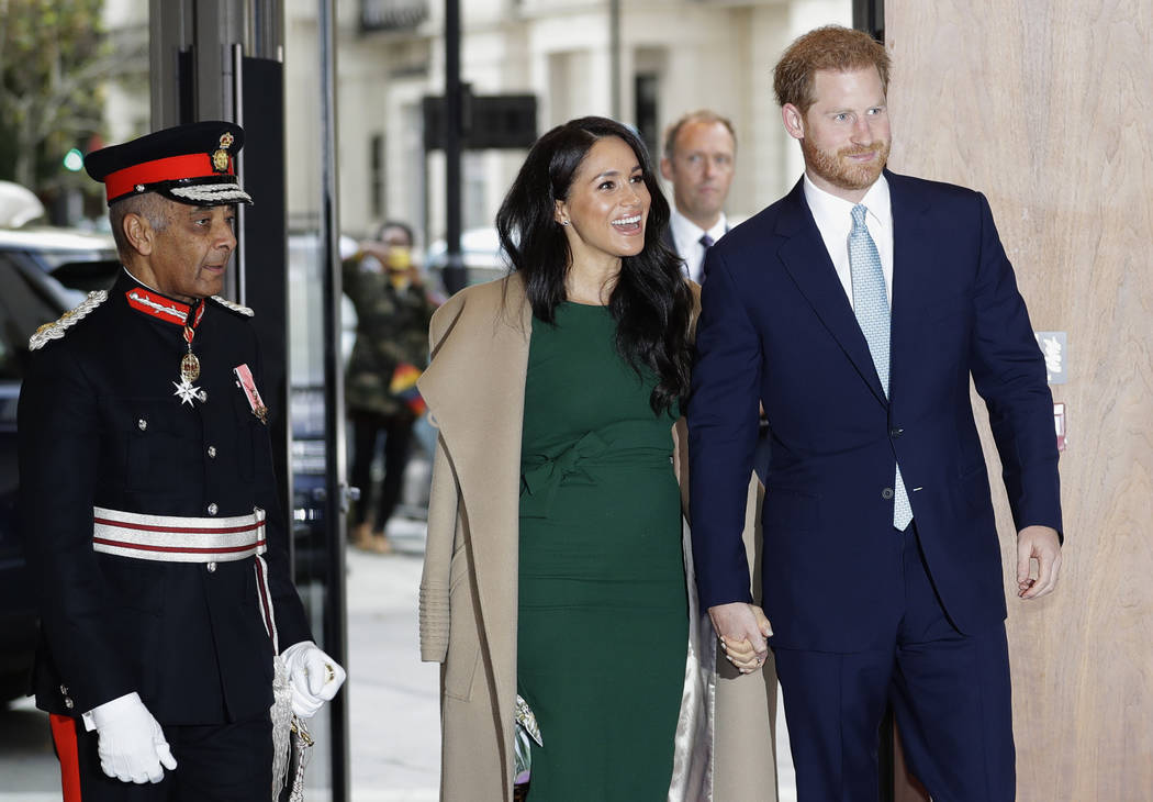 Britain's Prince Harry and Meghan, the Duke and Duchess of Sussex arrive to attend the WellChil ...