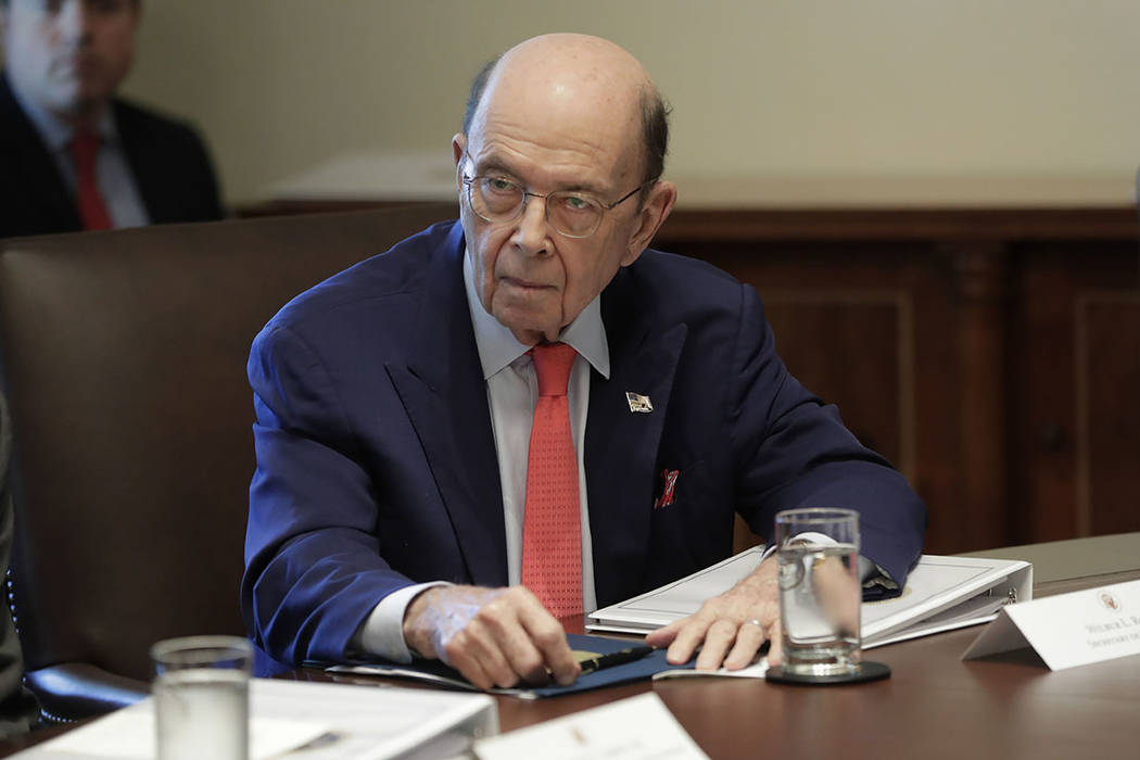 Commerce Secretary Wilbur Ross listening to President Donald Trump speak during a Cabinet meeti ...