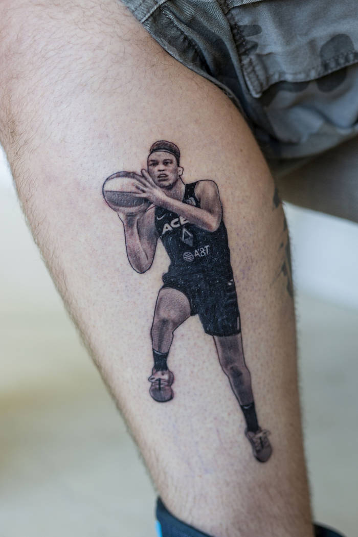 Local sports fan Trevor La Porte shows his recent tattoo of Las Vegas Aces player Dearica Hamby ...
