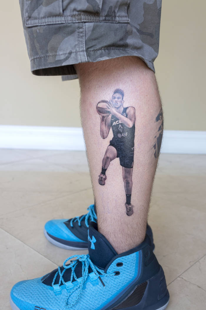 Local sports fan Trevor La Porte shows his recent tattoo of Las Vegas Aces player Dearica Hamby ...