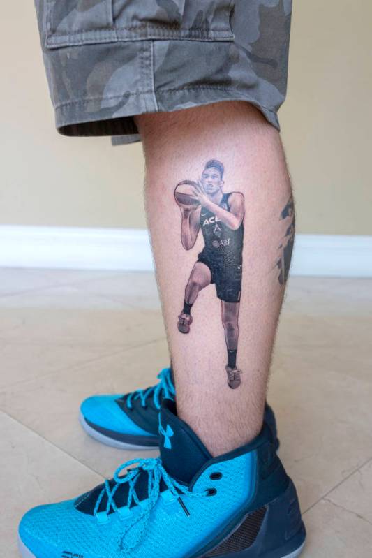 Local sports fan Trevor La Porte shows his recent tattoo of Las Vegas Aces player Dearica Hamby ...