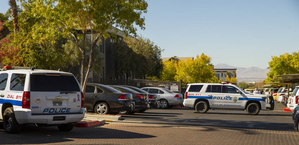 Officers work the scene of an officer-involved shooting at The Equestrian on Eastern Apartments ...