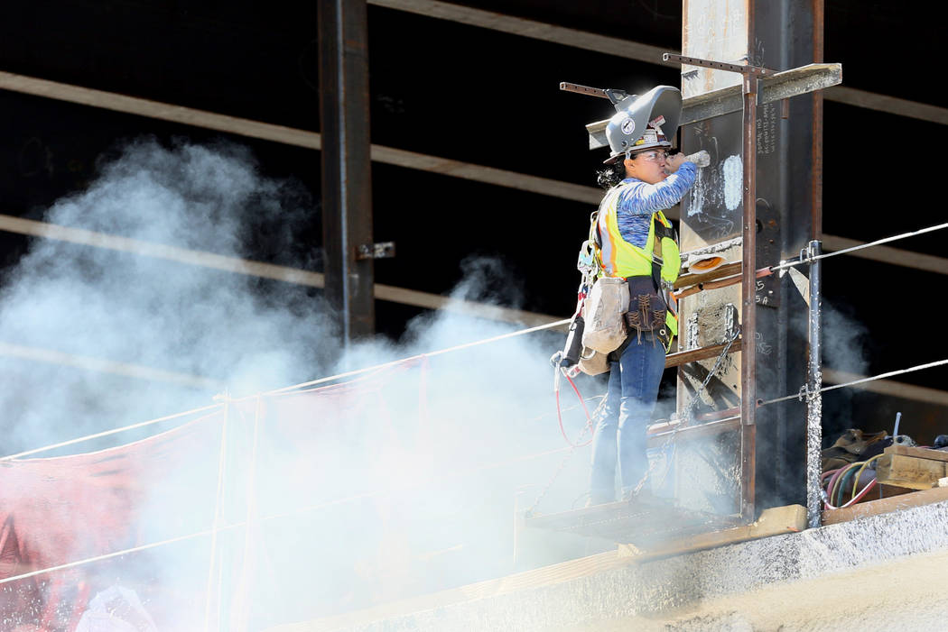 A worker takes a water break at the Circa construction site in downtown Las Vegas on Monday, Oc ...