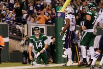 New York Jets quarterback Sam Darnold (14) reacts after the New England Patriots scored a safet ...