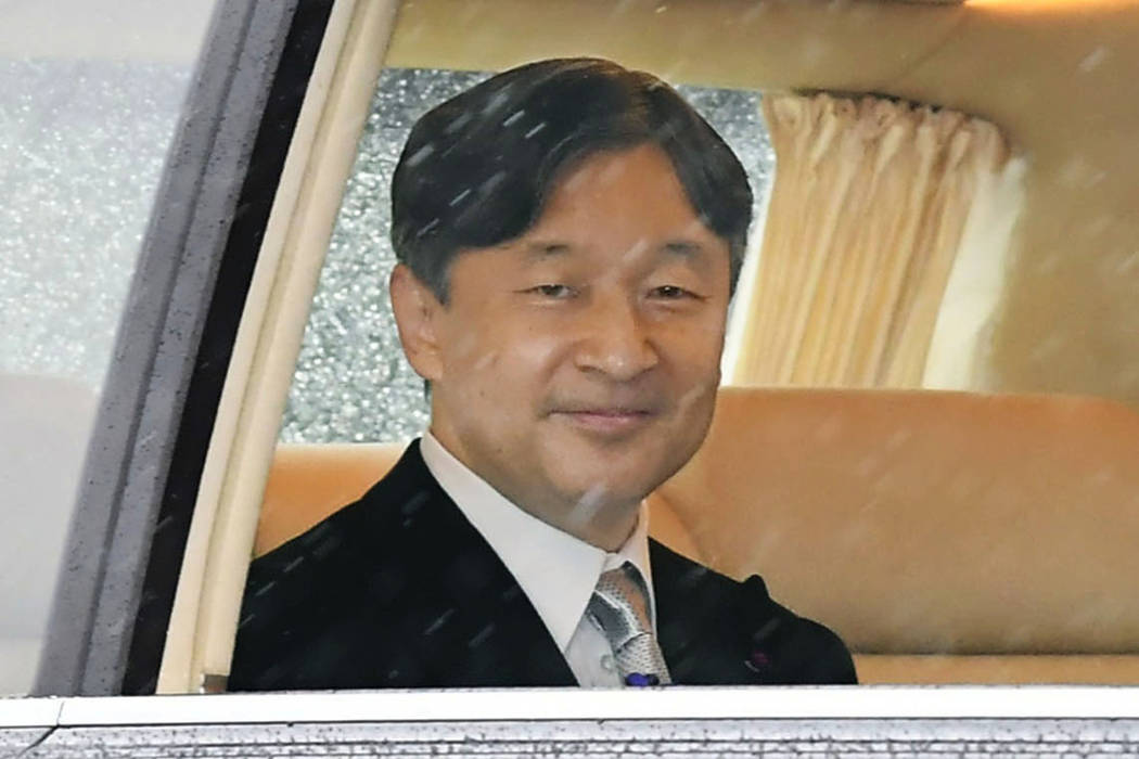 Japan's Emperor Naruhito depart for the Imperial Palace in Tokyo, Tuesday, Oct. 22, 2019. Empe ...