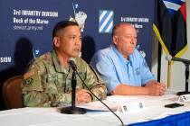 Army Maj. Gen. Antonio Aguto, left, and Army accident investigator Michael Barksdale hold a new ...