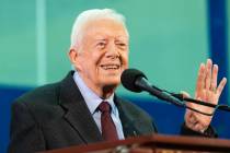 In a Sept. 18, 2019, file photo, former President Jimmy Carter acknowledges a student who's que ...