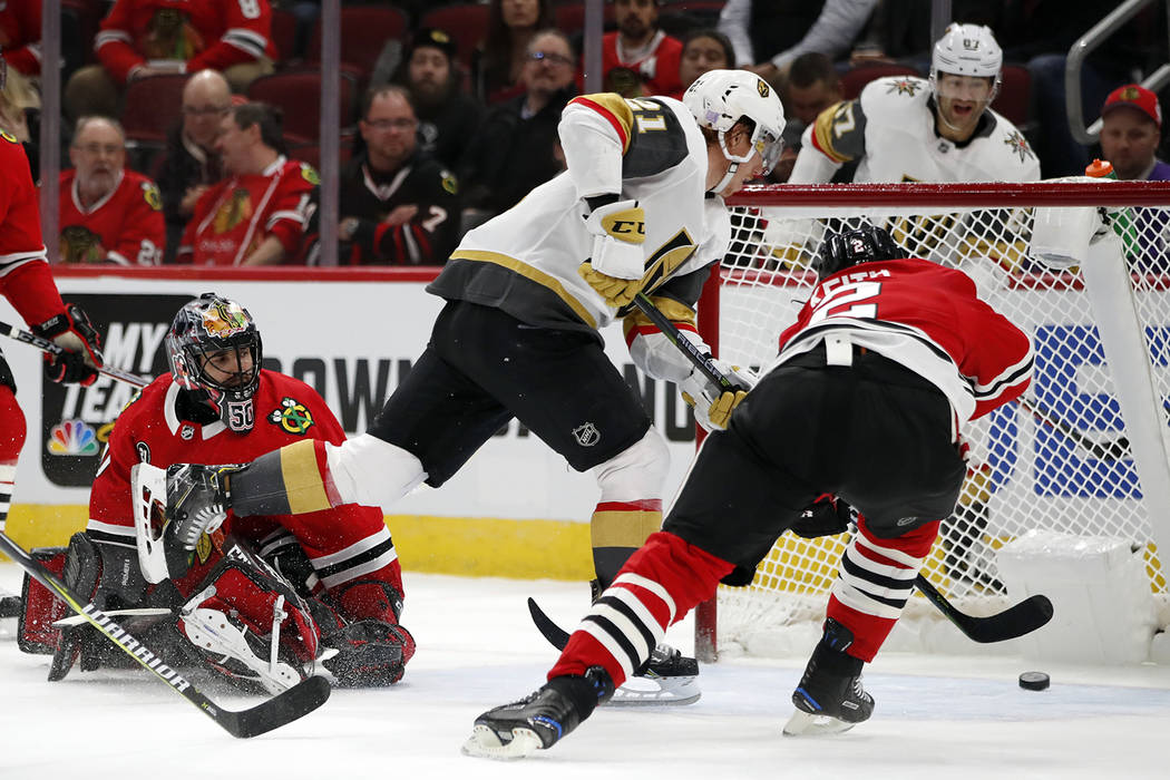 Vegas Golden Knights center Cody Eakin (21) scores a goal past Chicago Blackhawks goaltender Co ...