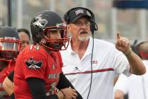 Kurt Palandech and UNLV offensive coordinator Barney Cotton during a game against Wyoming at Sa ...