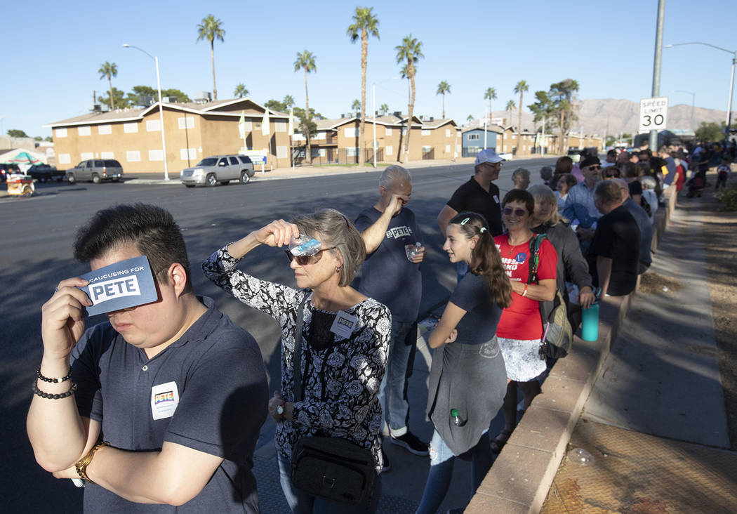 Keola Longo of Las Vegas shades his eyes while waiting in line for a Pete Buttigieg campaign ra ...