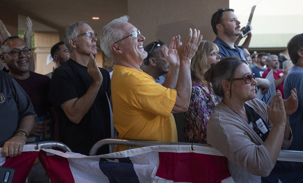 The crowd at a rally for presidential candidate Pete Buttigieg cheers as he discusses his healt ...