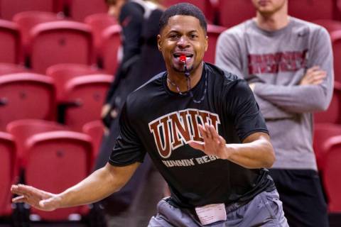 UNLV basketball assistant DeMarlo Slocum works the court as his players practice in the Thomas ...