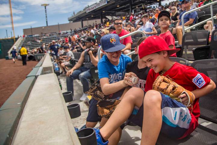 Robby Parker, 11, tries to steal the ball from his friend Jacob Freeman, 10, at the Las Vegas B ...