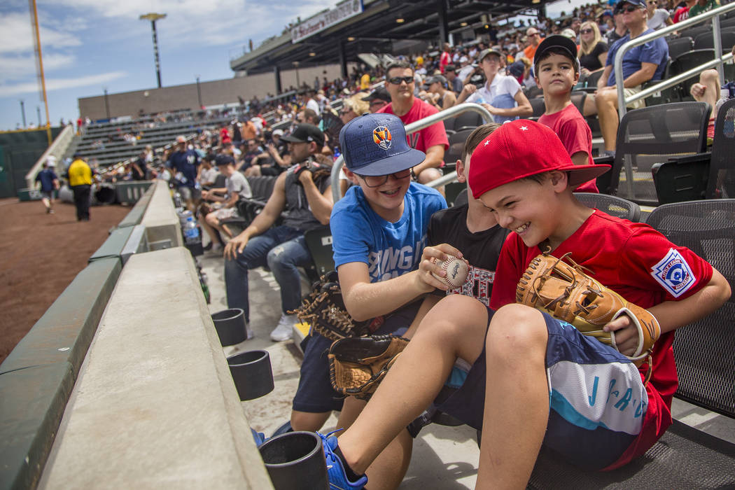 Robby Parker, 11, tries to steal the ball from his friend Jacob Freeman, 10, at the Las Vegas B ...