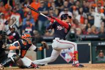 Washington Nationals' Juan Soto hits a two-run scoring double during the fifth inning of Game 1 ...