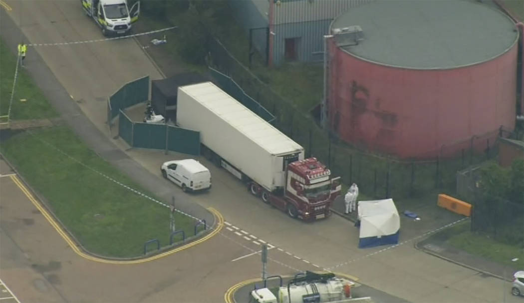 An aerial view as police forensic officers attend the scene after a truck was found to contain ...