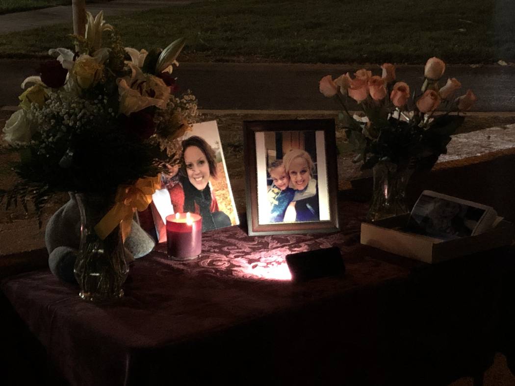 Pictures and flowers were lined up Oct. 15, 2019, during a vigil for 47-year-old Renai Palmer a ...