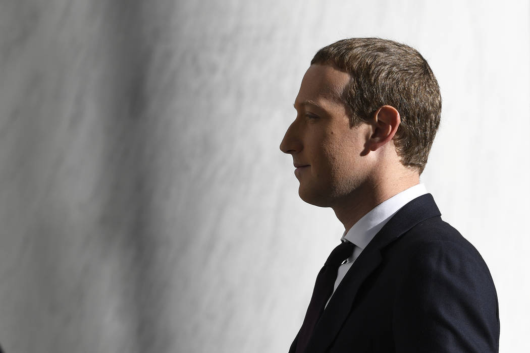 Facebook Chief Executive Officer Mark Zuckerberg arrives for a hearing before the House Financi ...