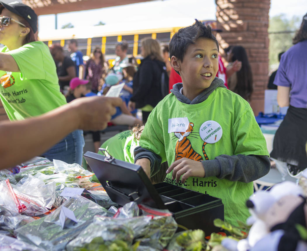 George E. Harris Elementary student Guiseppe Castro, 10, collects donations for their garden cl ...