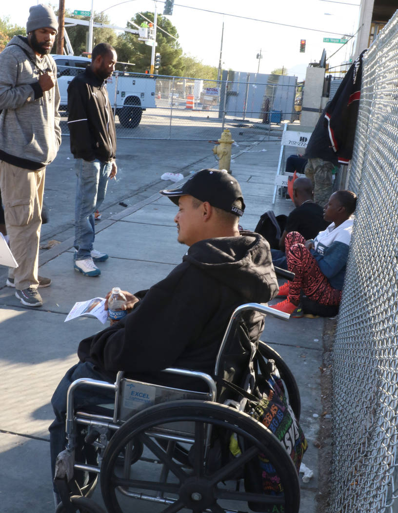 Clients, including Nicholas Lerma, 29, hangout outside the Courtyard Homeless Resource Center o ...