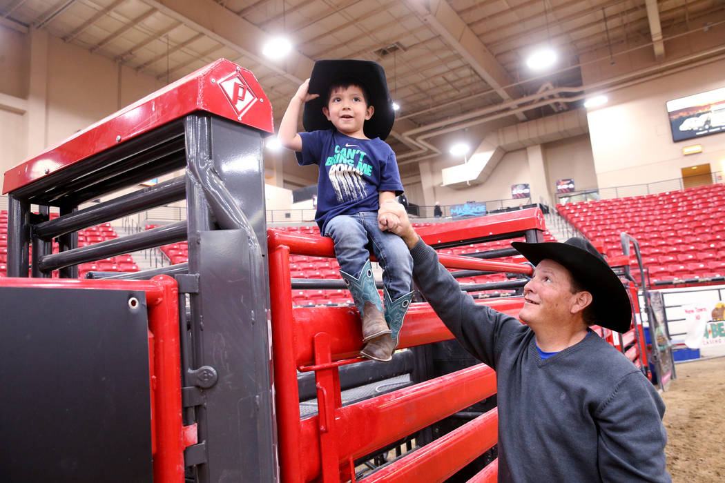Mike Not Afraid and his grandson, Grayson Spotted Bear, 2, in the arena during Indian National ...
