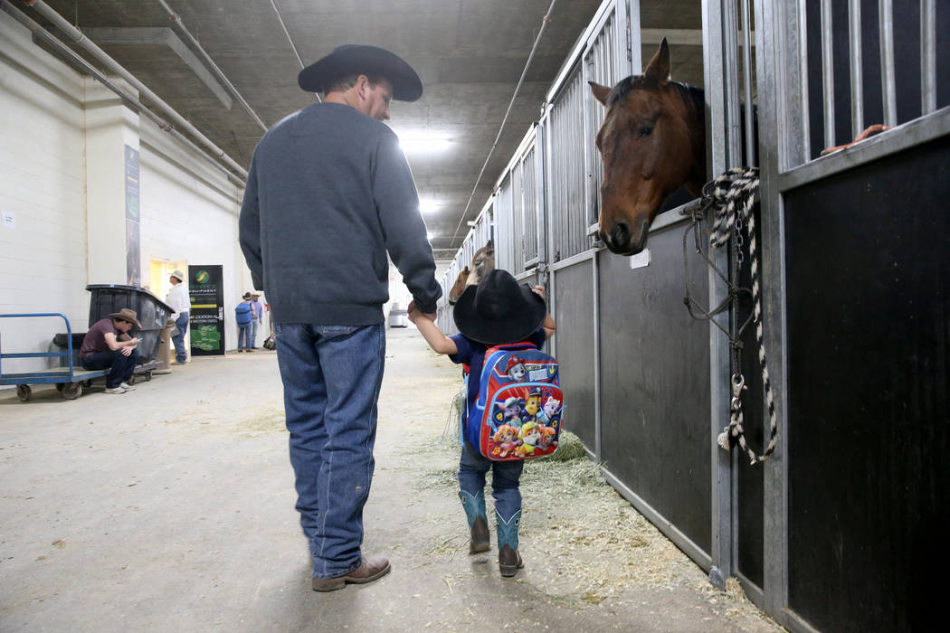Mike Not Afraid and his grandson, Grayson Spotted Bear, 2, during Indian National Finals Rodeo ...
