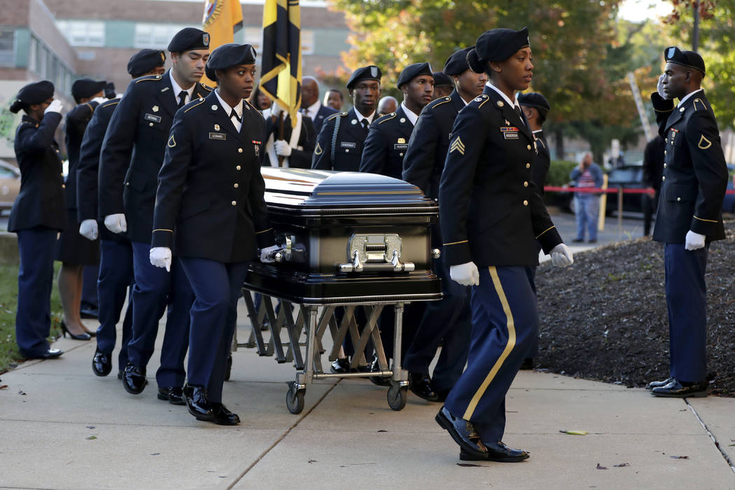 Pallbearers walk with a casket carrying the body of U.S. Rep. Elijah Cummings as it arrives at ...