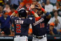Washington Nationals' Adam Eaton celebrates his two-run home run with Victor Robles during the ...