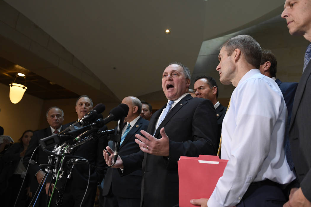 House Minority Whip Steve Scalise, R-La., center, standing with other House Republicans, talks ...