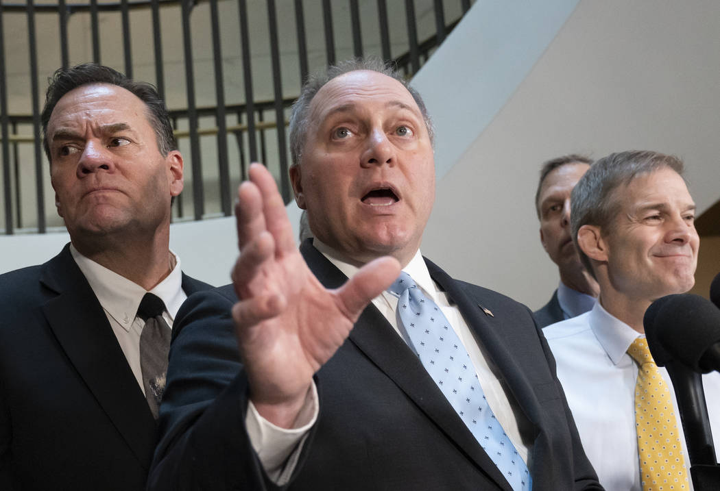 House Minority Whip Steve Scalise, R-La., flanked by Rep. Russ Fulcher, R-Idaho, left, and Rep. ...