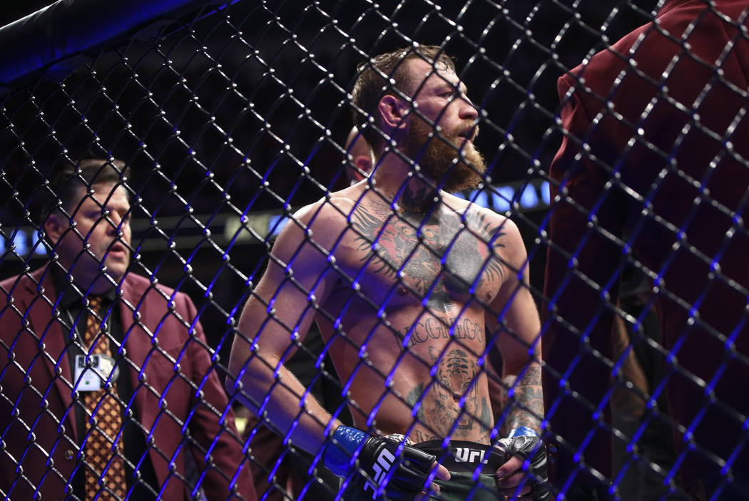 Conor McGregor reacts after his loss to Khabib Nurmagomedov in their lightweight title bout at ...