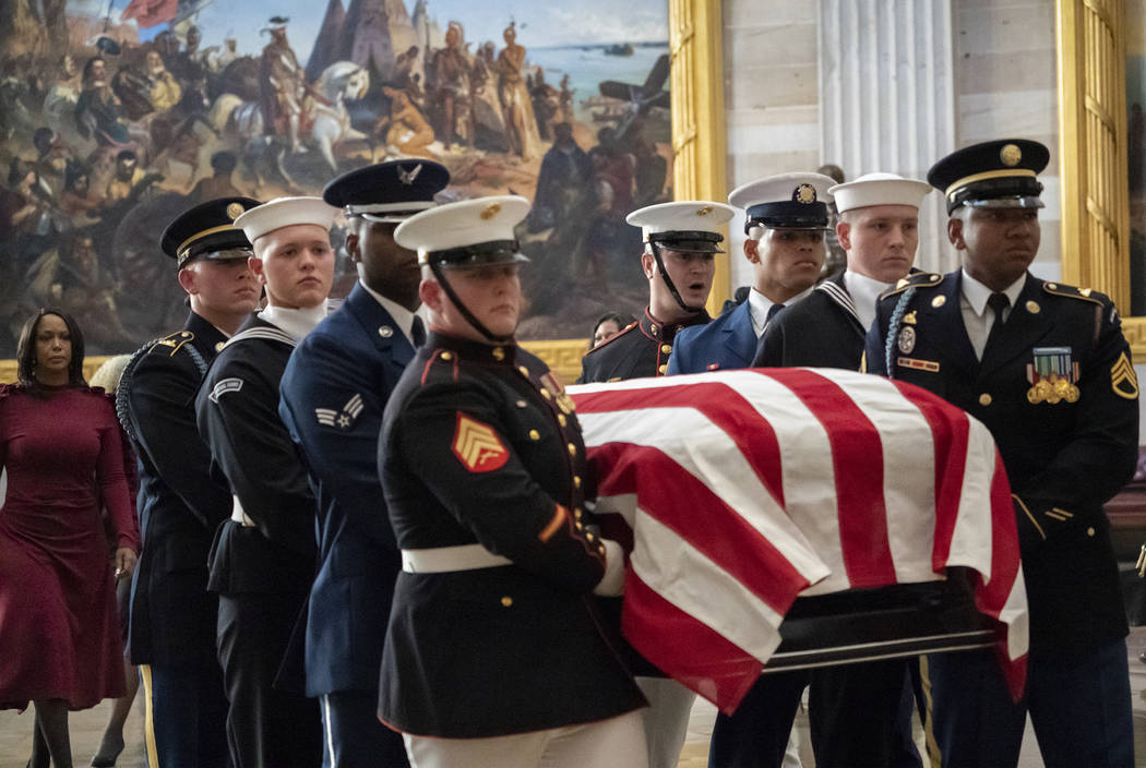 The late Maryland Rep. Elijah Cummings is carried through the Rotunda of the Capitol to lie in ...