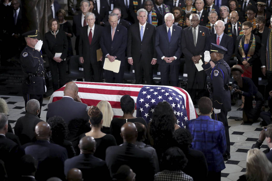 The flag-draped casket of Rep. Elijah Cummings, D-Md., lies in state at the Capitol, Thursday, ...