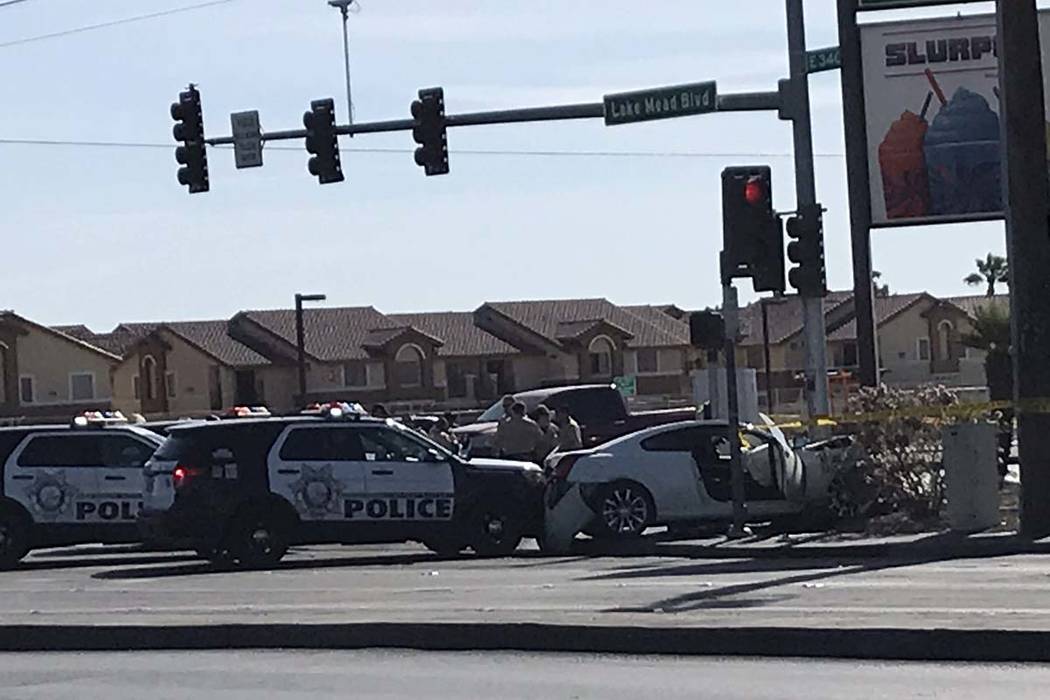 Police investigate an incident at the corner of Lake Mead Boulevard and Pecos Road where a stol ...