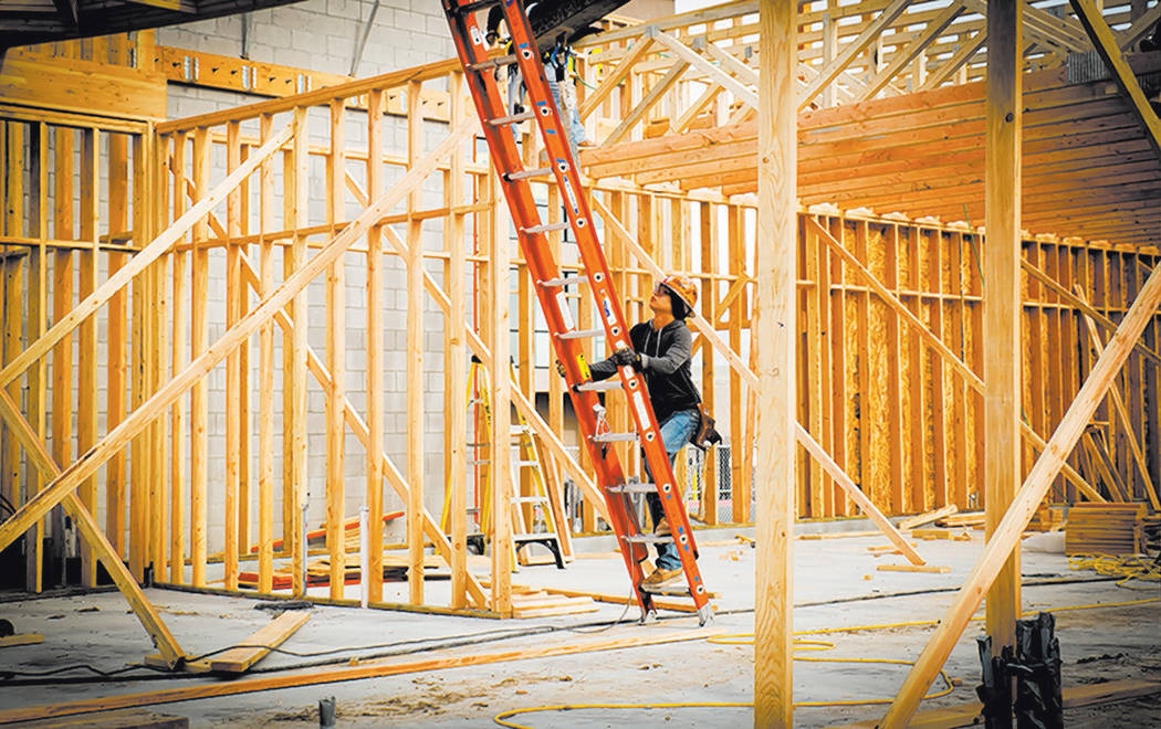 Tonya Harvey RJRealEstate.Vegas This file photo shows a worker at a new-home construction site. ...