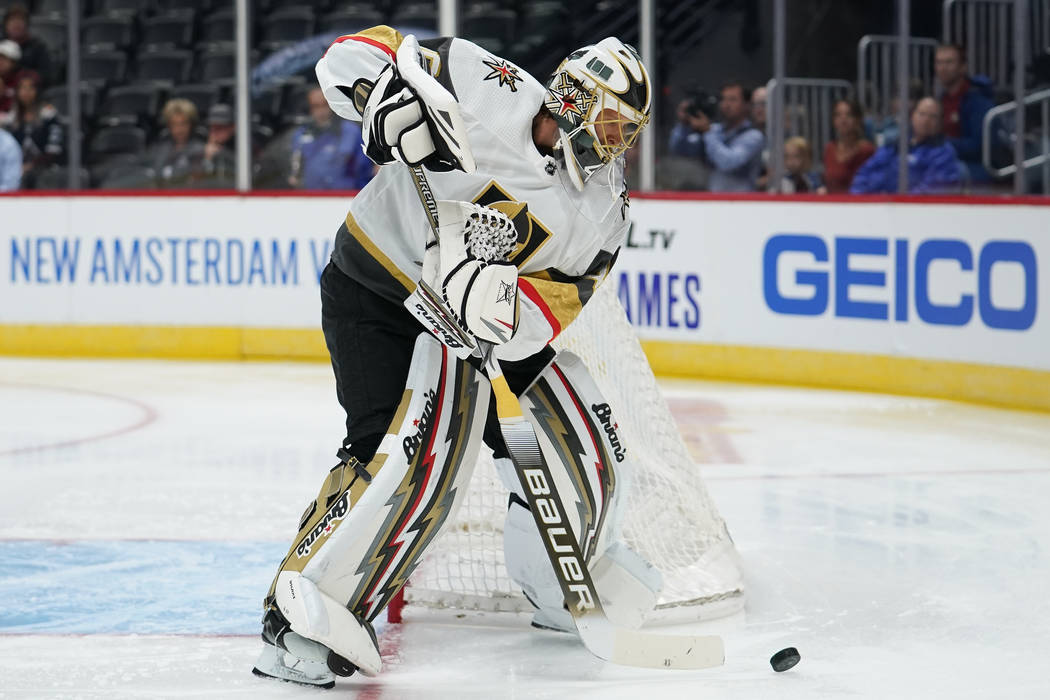 Vegas Golden Knights goaltender Garret Sparks clears the puck during a preseason NHL hockey gam ...