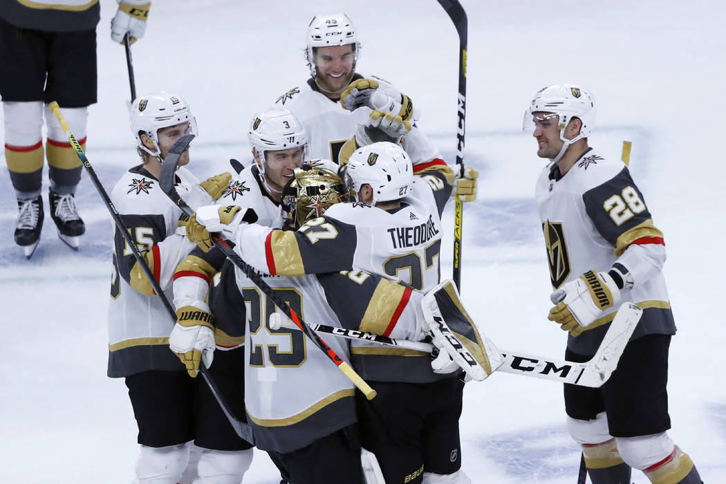 The Vegas Golden Knights celebrate Shea Theodore's shootout goal against the Chicago Blackhawks ...
