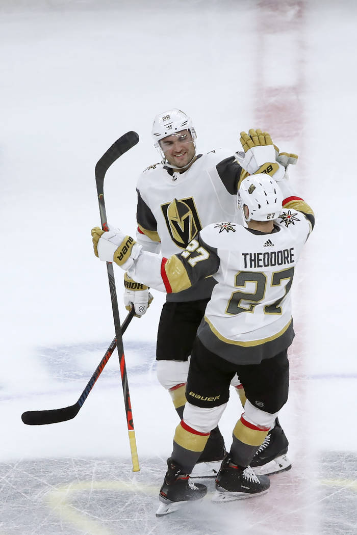 Vegas Golden Knights left wing William Carrier (28) celebrates with Shea Theodore after Theodor ...