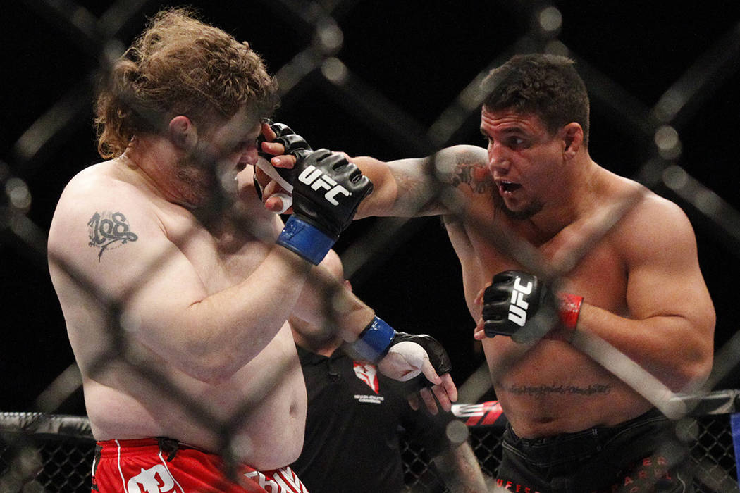 Frank Mir, right, fights Roy Nelson in their heavyweight bout at UFC 130 at the MGM Grand in La ...