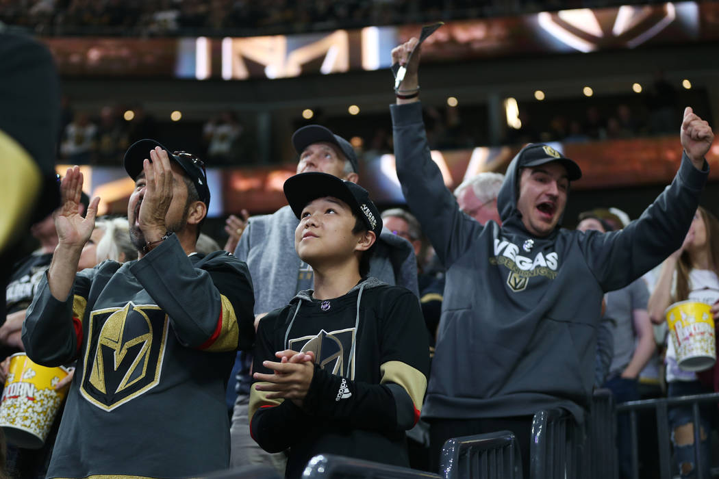 Fans celebrates a score by Vegas Golden Knights center William Karlsson (71) during the first p ...