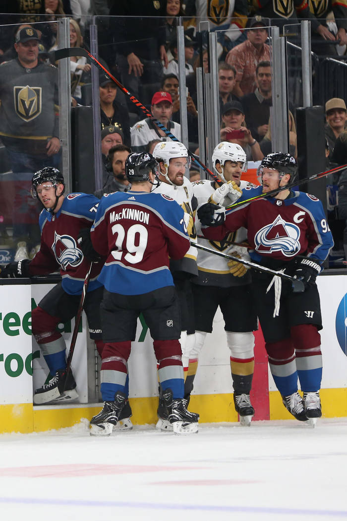 Vegas Golden Knights right wing Mark Stone (61), center, gets into a scuffle with Colorado Aval ...