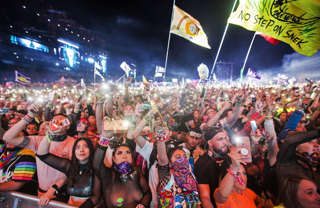 A sea of concert goers dance during SAYMYNAME's performance at the Circuit Grounds stage on day ...