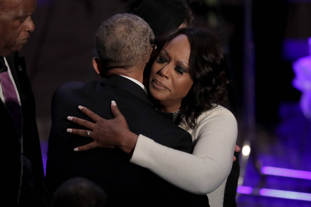 Maya Rockeymoore Cummings, right, is greeted by former President Barack Obama during funeral se ...