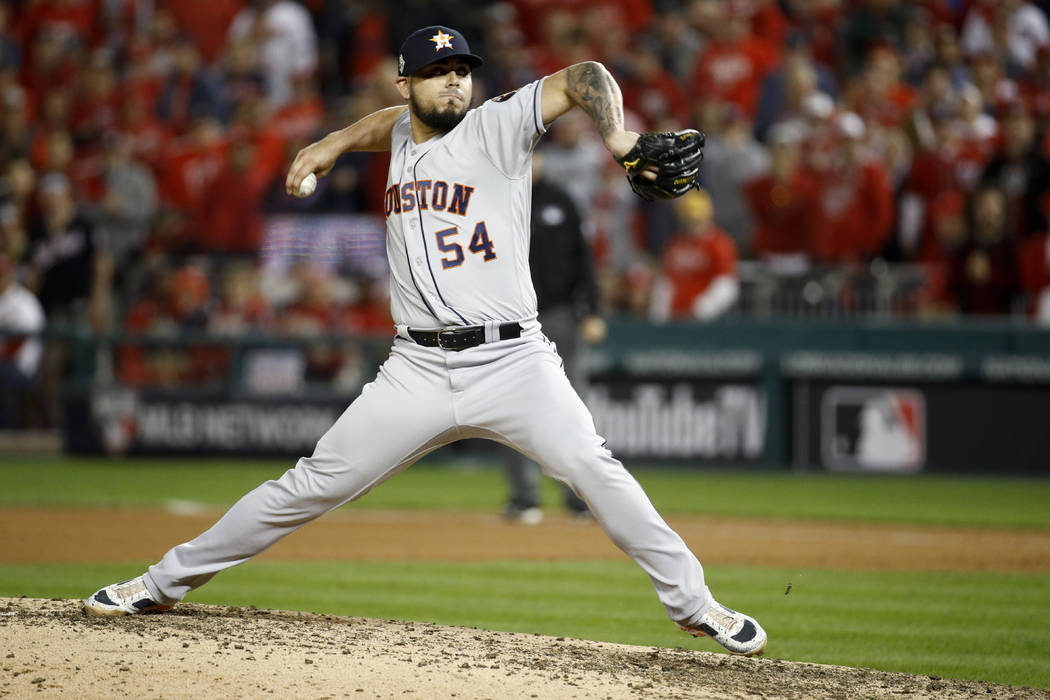 Houston Astros relief pitcher Roberto Osuna throws against the Washington Nationals during the ...