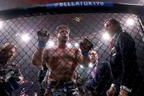 Frank Mir, center, reacts losing to Fedor Emelianenko, of Russia, in a heavyweight mixed martia ...