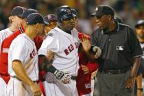 FILE - In this Aug. 17, 2004, file photo, Boston Red Sox David Ortiz, center, is restrained by ...