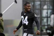 FILE - In this Aug. 20, 2019 file photo, Oakland Raiders' Antonio Brown smiles before stretchin ...