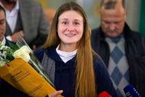 Russian agent Maria Butina smiles as she speaks to journalists upon her arrival from the United ...