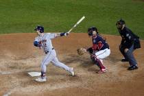 Houston Astros' Alex Bregman hits a grand slam during the seventh inning of Game 4 of the baseb ...
