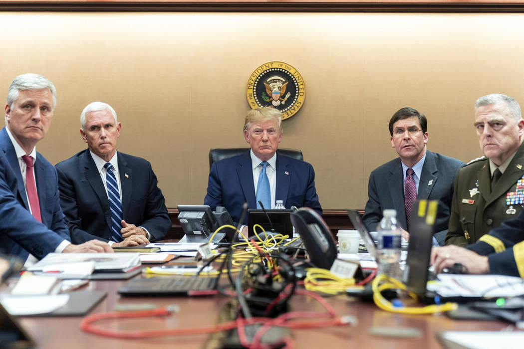 In this image released by the White House, President Donald Trump is joined by Vice President M ...